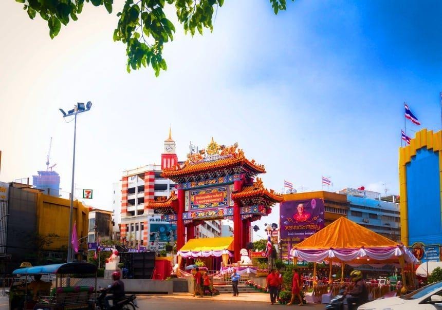 Red and gold China Gate at Wongwian Odeon beneath a blue Bangkok sky